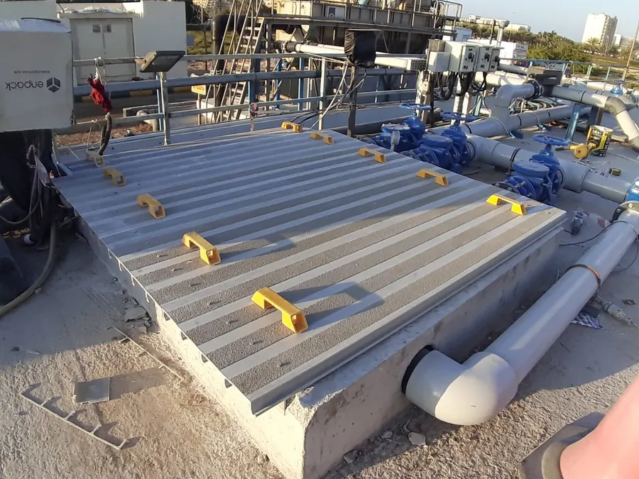 GRP plates with lifting handles over a channel