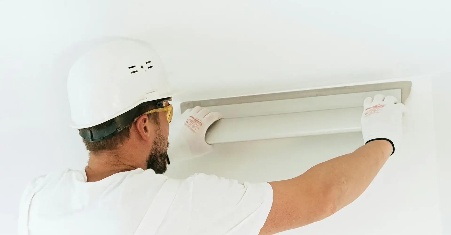 Technician finishing a ceiling surface