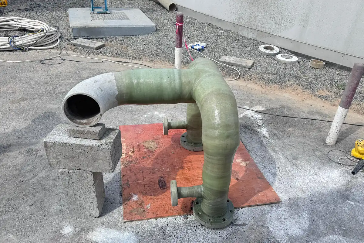 GRP pipe bend installed on a support