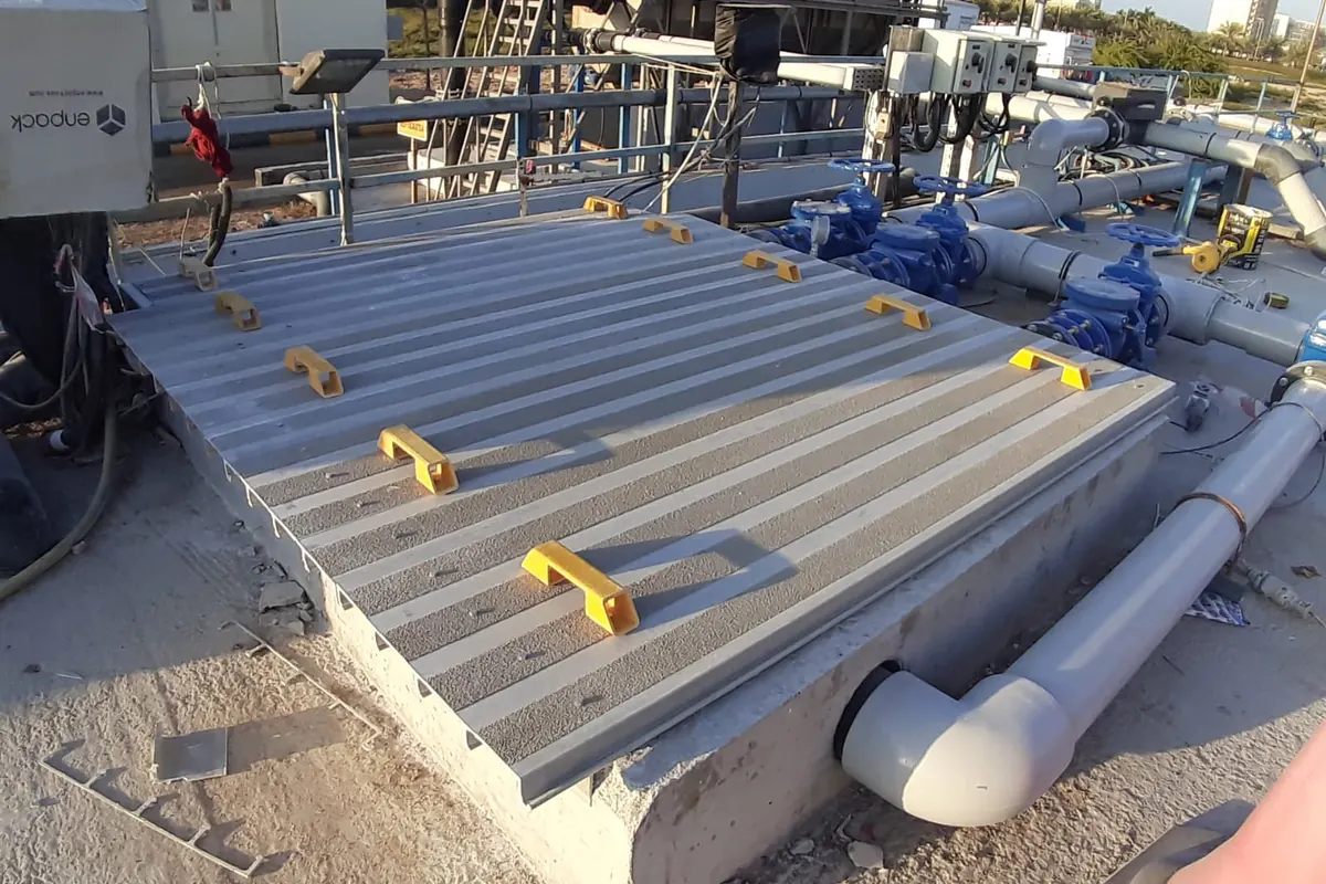 GRP plates with lifting handles installed over a channel